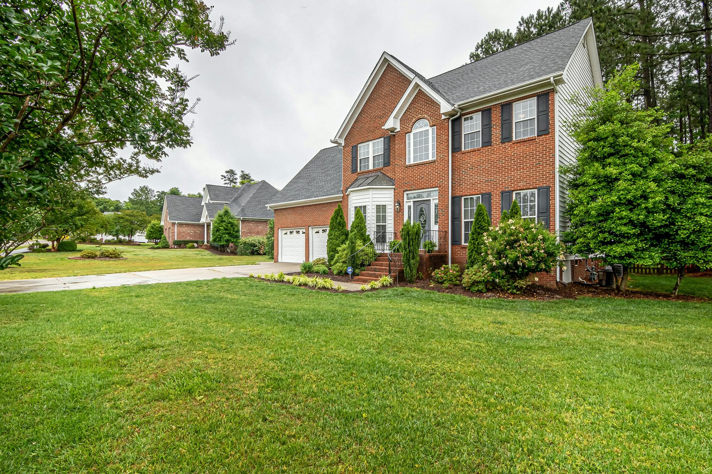 A manicured front lawn in front of a home